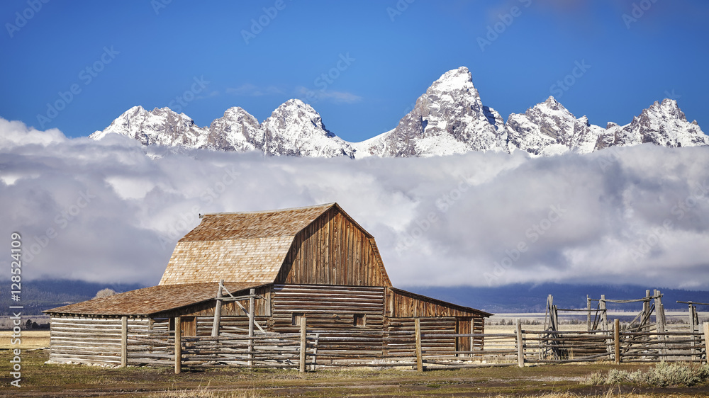 Teton mountain range with Moulton Barn in the Grand Teton National Park, Wyoming, USA.