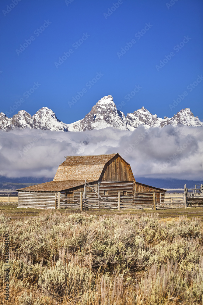 Teton mountain range with Moulton Barn in the Grand Teton National Park, Wyoming, USA.