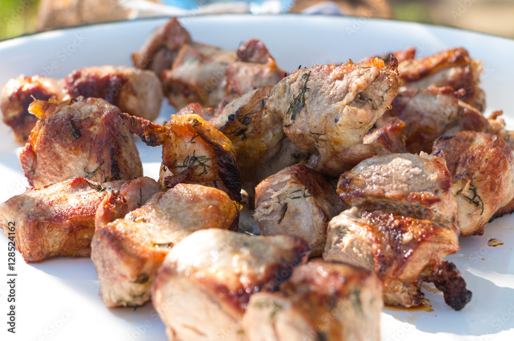 Close up grilled pork Shashlik. Is a form of Shish kebab popular in Europe and Russia. Shashlyk (meaning skewered meat) was originally made of lamb.