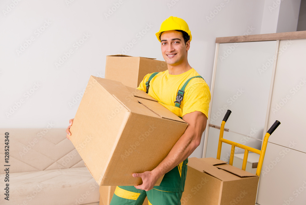 Man delivering boxes during house move Man delivering boxes during house move