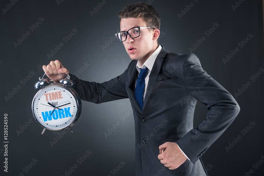 Young businessman in business time concept Young businessman in business time concept