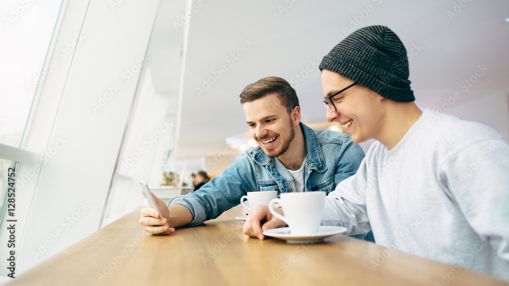 © alexshutter95 - Men are sitting in front of the table near window