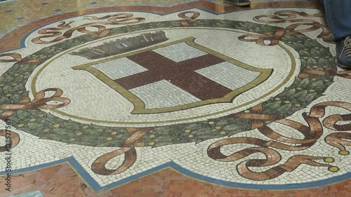 Time-lapse of busy passengers and tourist walking in Galleria Vittorio Emanuele II, in Milan.  Since it is one of Milan's most popular attractions of the city