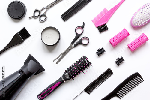 combs and hairdresser tools on white background top view