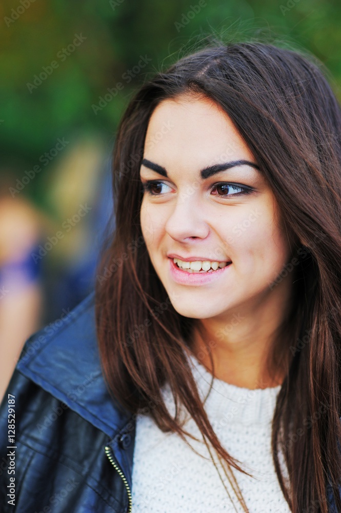 portrait of a beautiful girl with long hair in a black shirt smiling portrait of a beautiful girl with long hair in a black shirt smiling