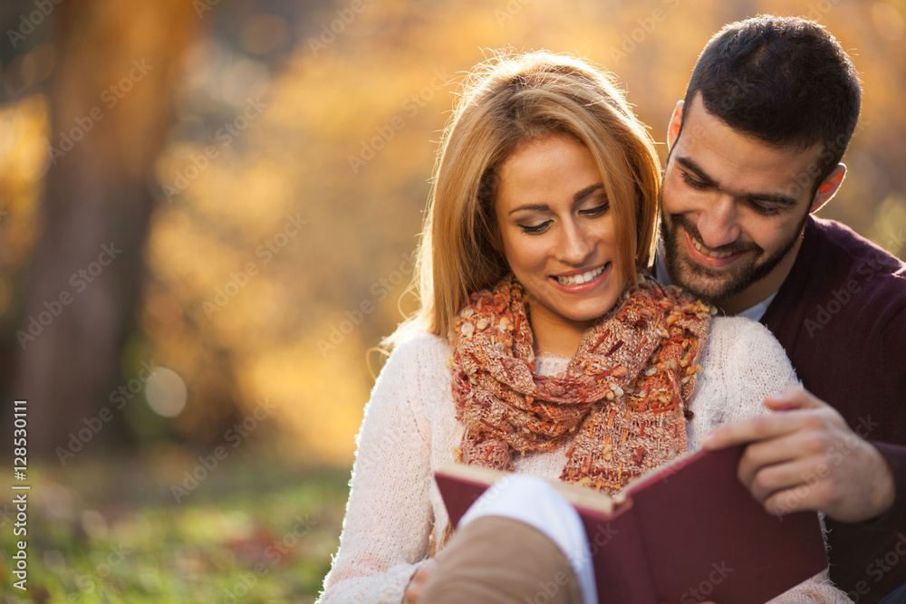 Fototapeta premium passionate love in the autumn park. A young couple