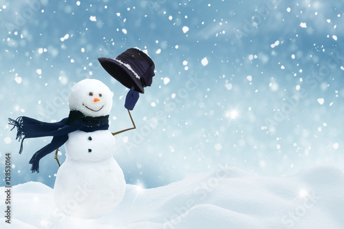 Fototapeta Happy snowman standing in christmas landscape