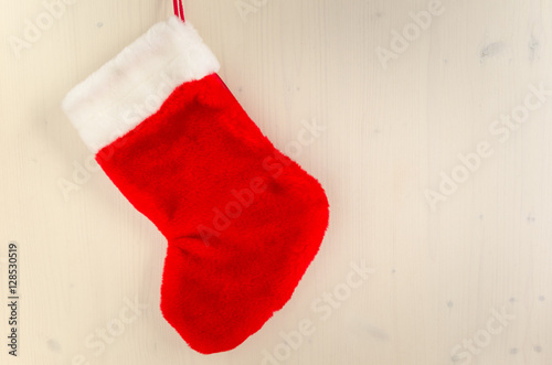 Red Christmas Sock on Wooden Background