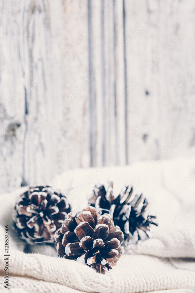 Fir cones on white wooden background Fir cones on white wooden background