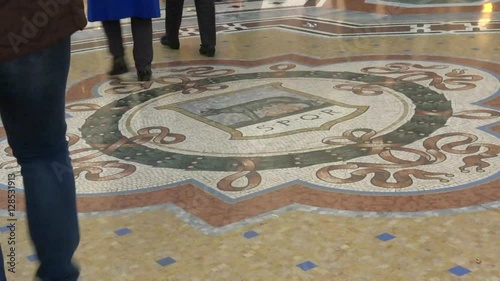 Time-lapse of busy passengers and tourist walking in Galleria Vittorio Emanuele II, in Milan.  Since it is one of Milan's most popular attractions of the city