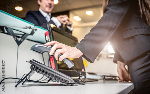 Secretary answering the phone in an office