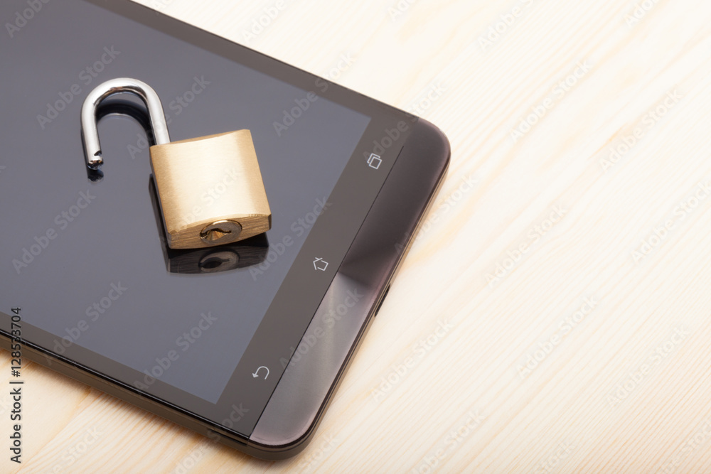 Smartphone with an unlocked lock over it. Mobile phone security and data protection concept Smartphone with an unlocked lock over it. Mobile phone security and data protection concept