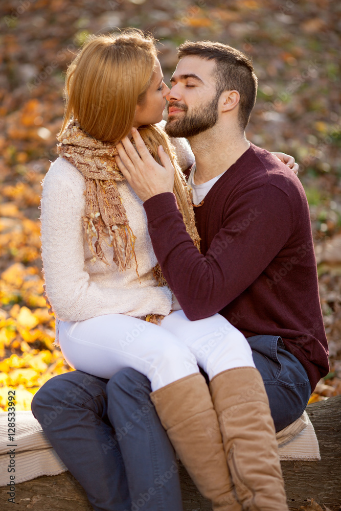 Fototapeta premium sensual outdoor portrait of young stylish fashion couple kissing