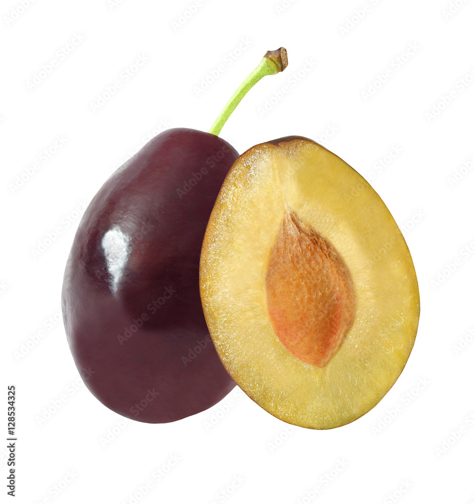 whole and cut in half plums isolated on white background with clipping path