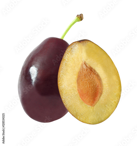 whole and cut in half plums isolated on white background with clipping path