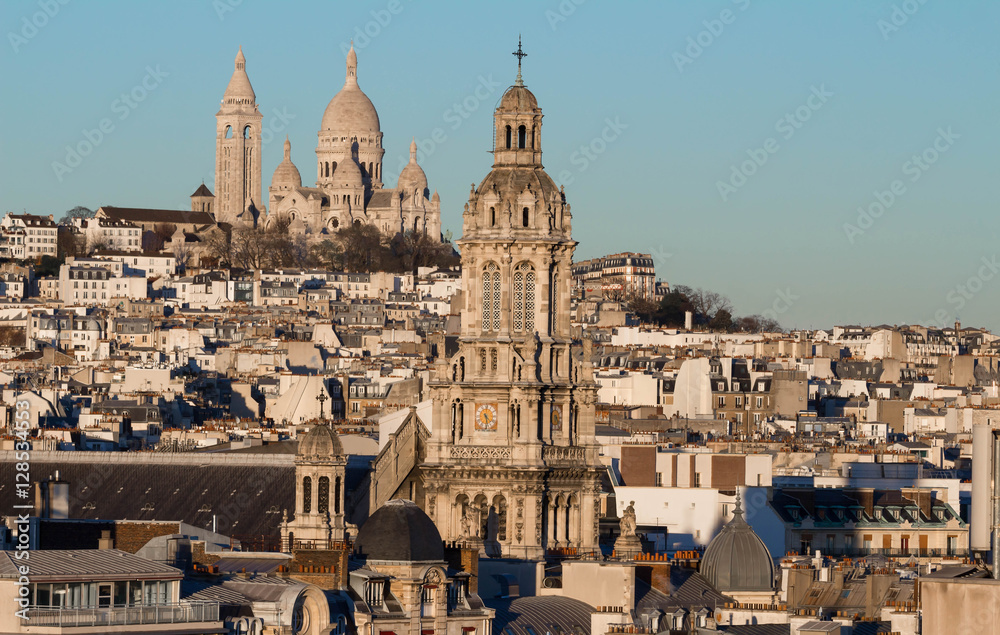 The Saint Trinity church and Sacre Coeur basilica, Paris, France