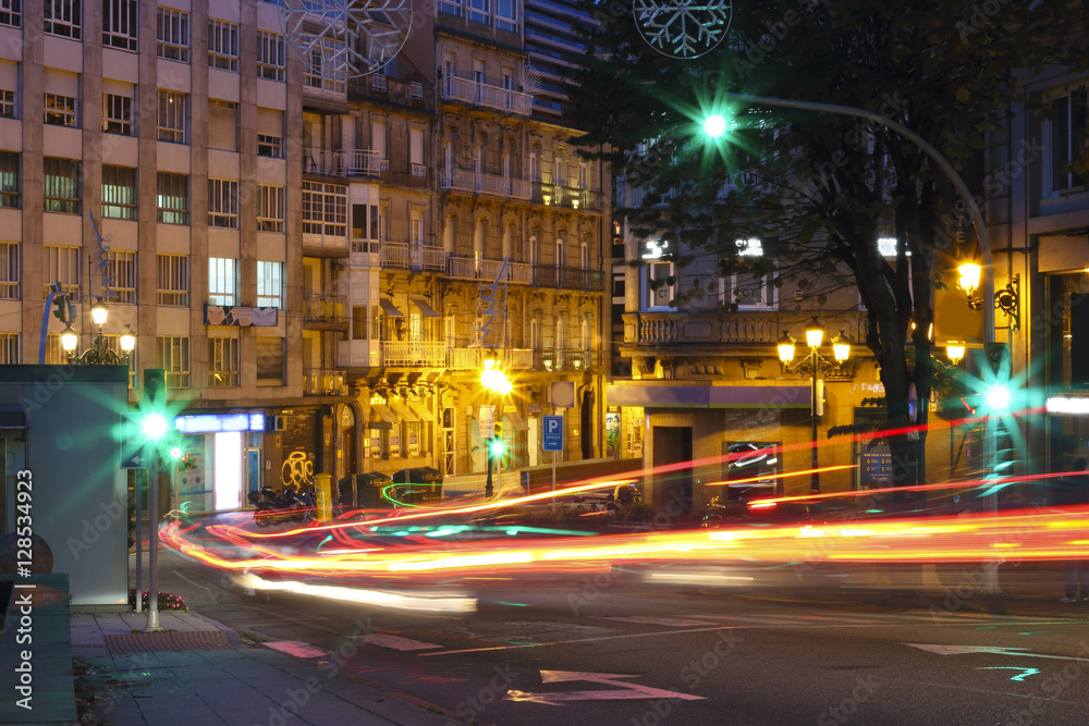 Vigo at night with cars in motion