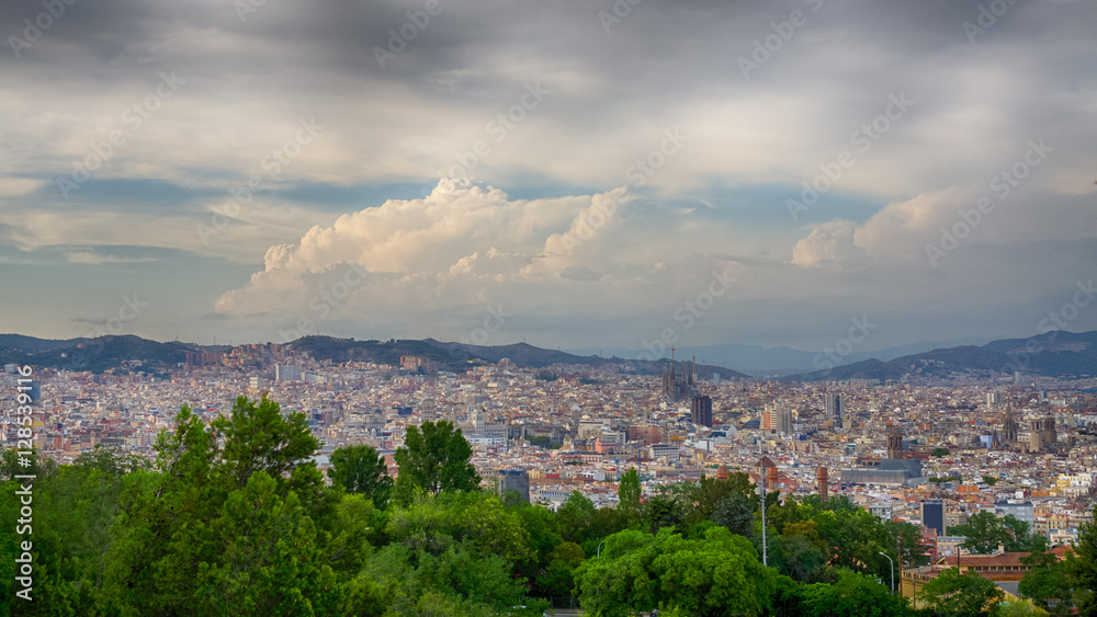 Beautiful white clouds over Barcelona city in summer, Spain