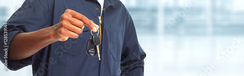 Car mechanic with key. photo