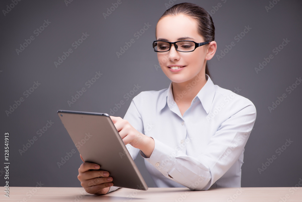 Businesswoman working on tablet computer Businesswoman working on tablet computer