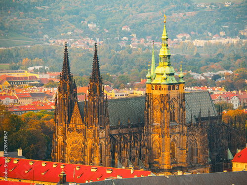 St Vitus Cathedral - landmark of Prague Castle historical complex. Aerial view from Petrin Hill Lookout Tower in the evening sunset time. Prague capital city of Czech Republic, Europe. UNESCO World