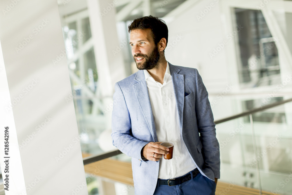 Fototapeta premium Businessman drinking coffee