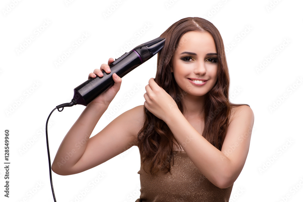 Fototapeta premium Young beautiful woman with hair dryer isolated on white