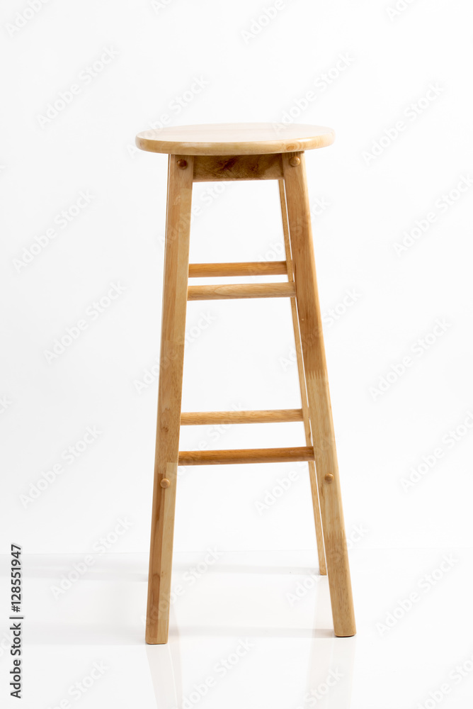 Wooden bar chair isolated on white background. Wooden light pine dining stool. Natural, solid wood bench.