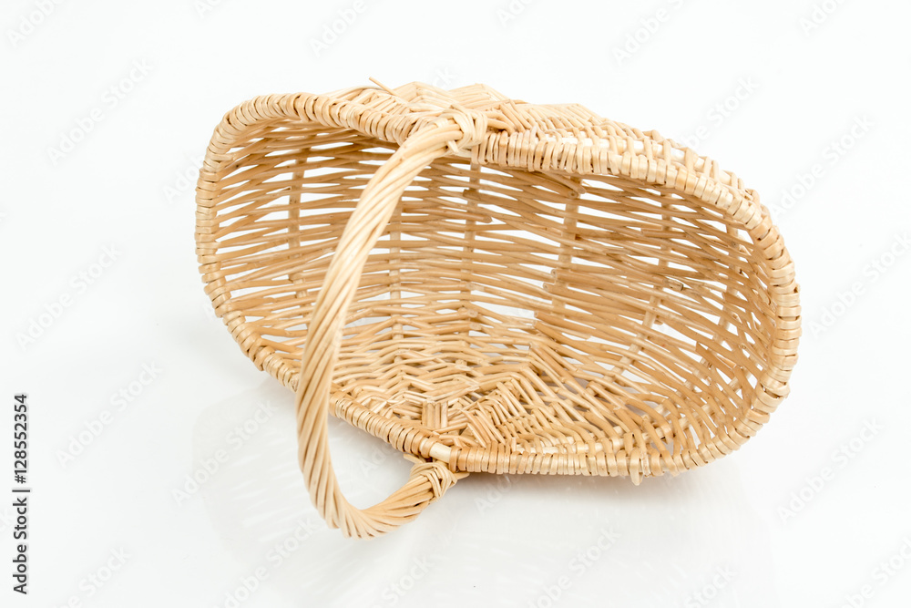 Empty wooden woven fruit/bread basket on white background. Wicker basket.  Plaited container. Natural wood (brown) color. Winter, Christmas, New Year,  enterteinment place decoration. Top, side view. Stock Photo | Adobe Stock