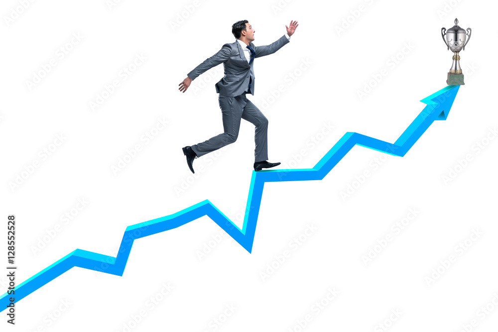 Businessman running towards prize cup trophy Businessman running towards prize cup trophy