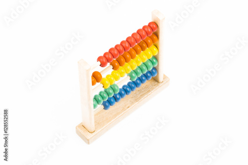 Traditional abacus with colorful wooden beads on white background. Toy abacus to learn counting. Colorful children counting frame for kids. Top side view.