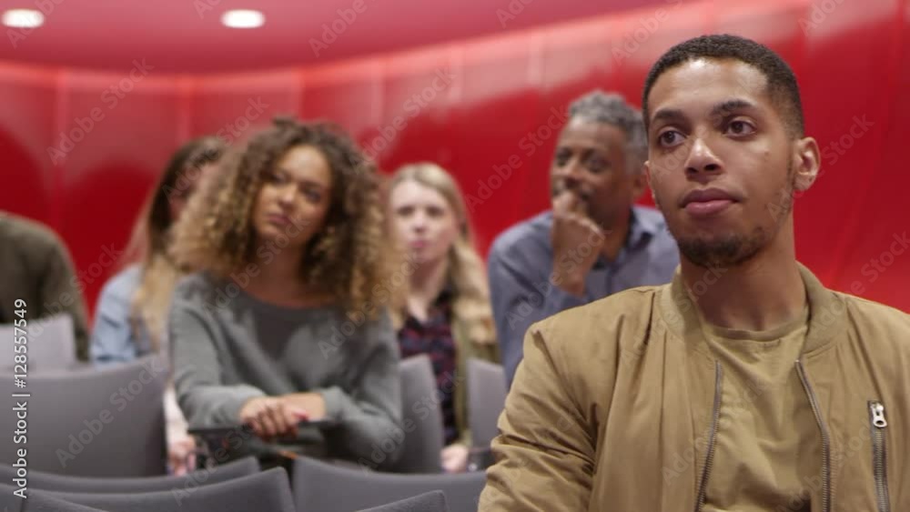 University students sitting in a lesson, close up front view, shot on R3D University students sitting in a lesson, close up front view, shot on R3D