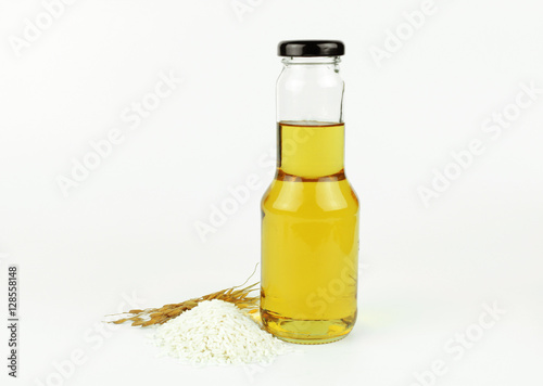 Rice bran oil in bottle glass and rice