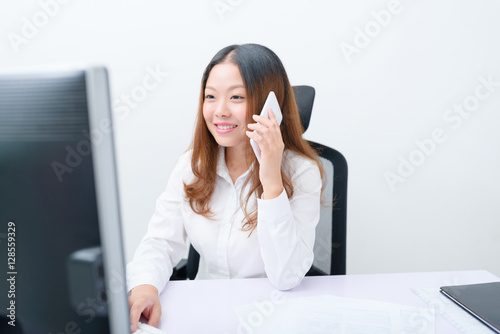 Young businesswoman working on computer.