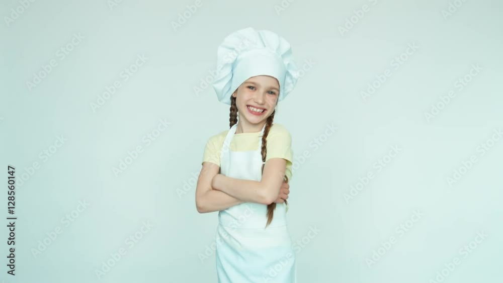 Portrait chef girl smiling with teeth on white. Thumbs up. Ok Portrait chef girl smiling with teeth on white. Thumbs up. Ok