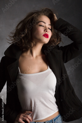 sensual young woman posing on black background