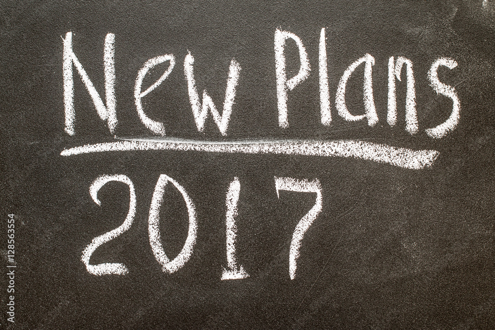Fototapeta premium New Plan 2017 handwritten with white chalk on a blackboard 