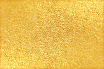 Shiny yellow leaf gold foil texture background