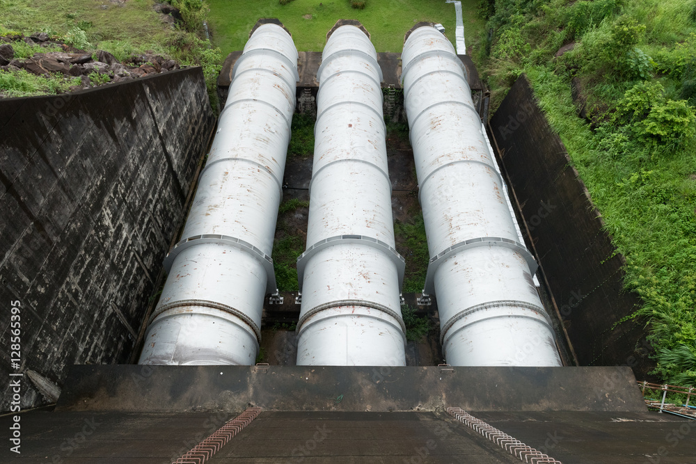 Large water pipe in a sewage treatment plant, with digestion tan Large water pipe in a sewage treatment plant, with digestion tan