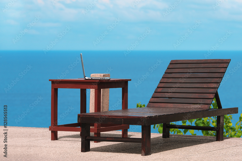 Working online from a tropical beach with laptop computer. Stock image. Working online from a tropical beach with laptop computer. Stock image.