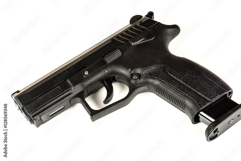 The black gun (pistol) on a white background close up. Isolate. The black gun (pistol) on a white background close up. Isolate.