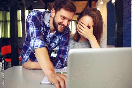 Young professionals work in modern office.