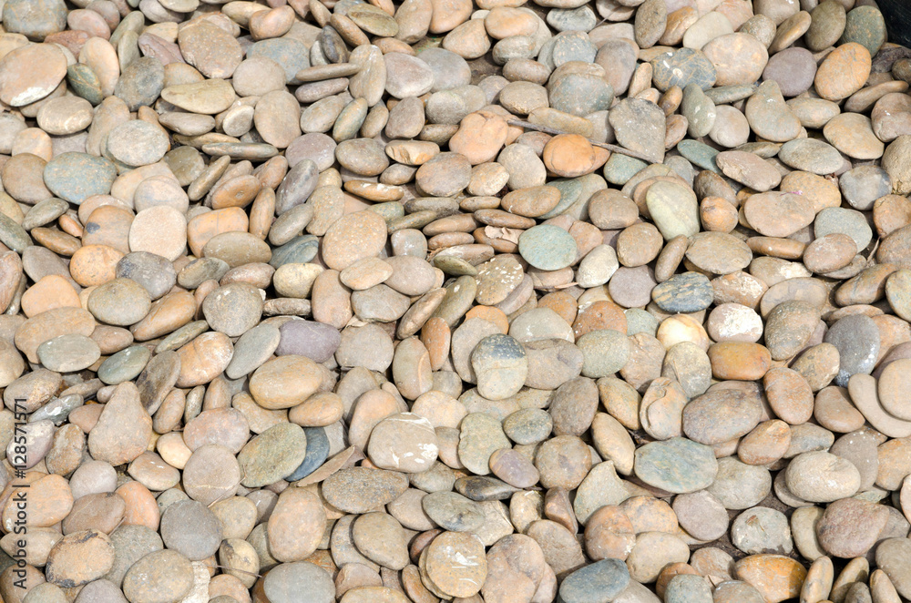 Stones, pebbles stack on the floor for background Stones, pebbles stack on the floor for background