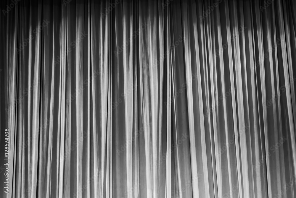 Obraz premium Black and white curtains and light.