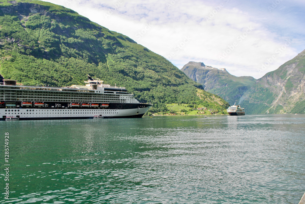 Luxury Cruise Ship Sailing from Port Norway mountains in the background