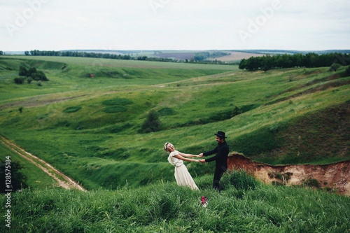 The couple holding hands