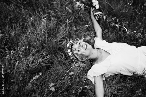 Happy smiling bride in grass