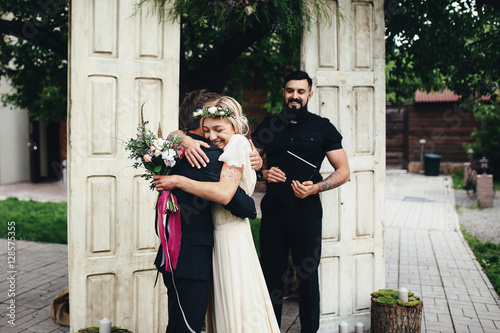 Pretty bride holding her groom