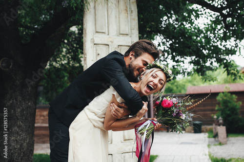 Groom and bride with flowers