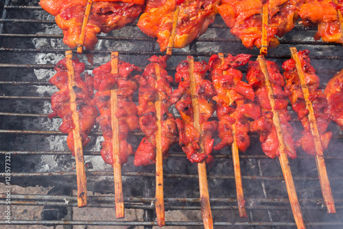  chicken babeque on grill photo